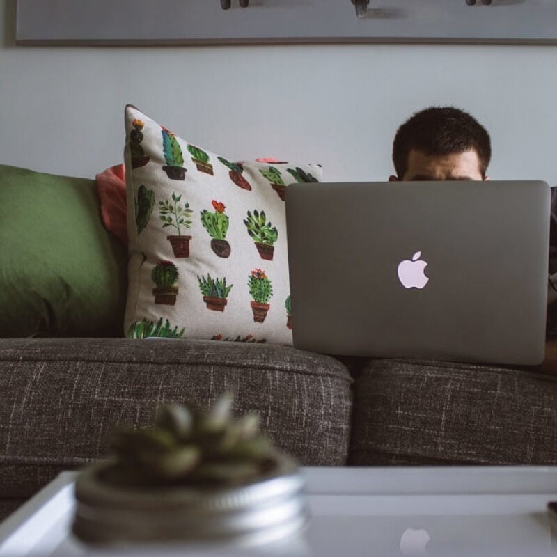 Cotton Shop - man sitting behind laptop in casual wear