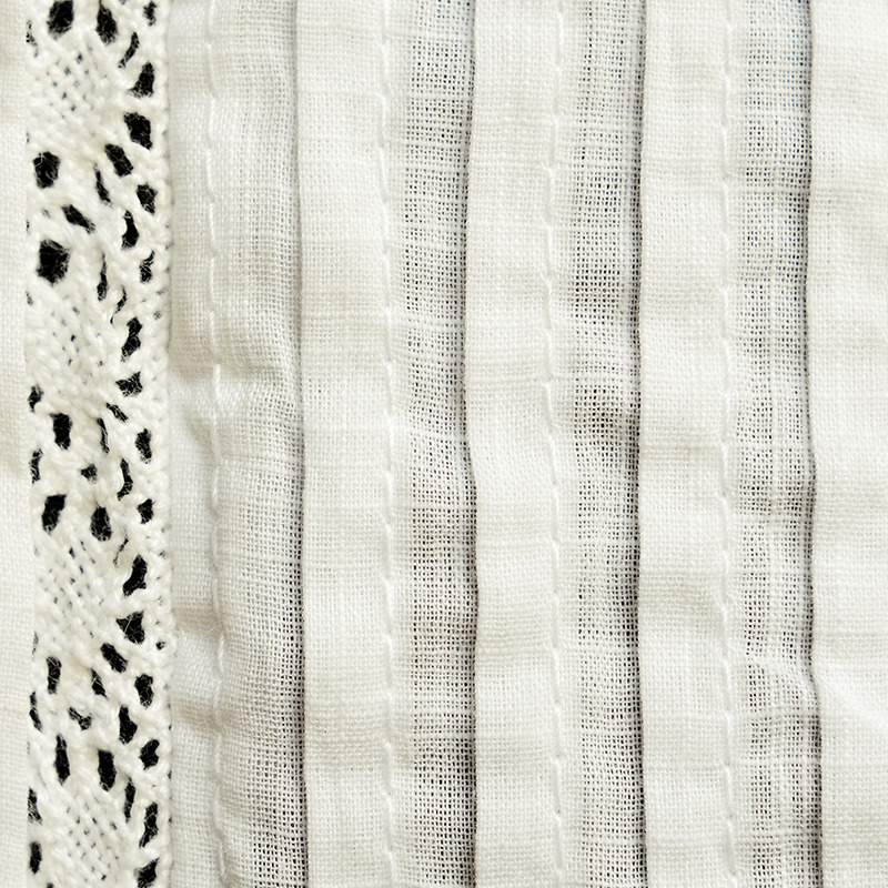 close up of cotton batiste fabric of women's shirt