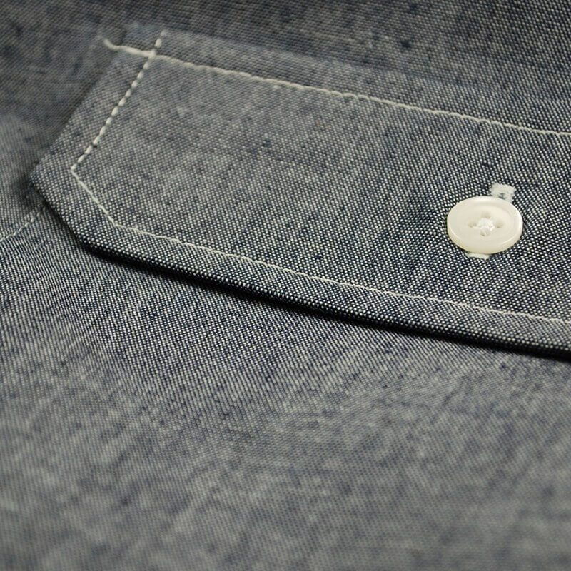 close up of chambray shirt with button