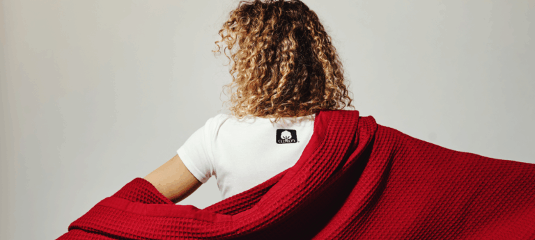 woman wearing t shirt with seal of cotton logo